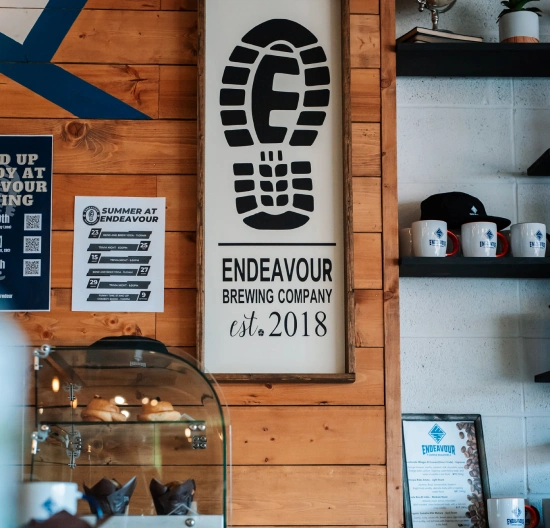 Endeavour's footprint logo on a poster in their taproom.